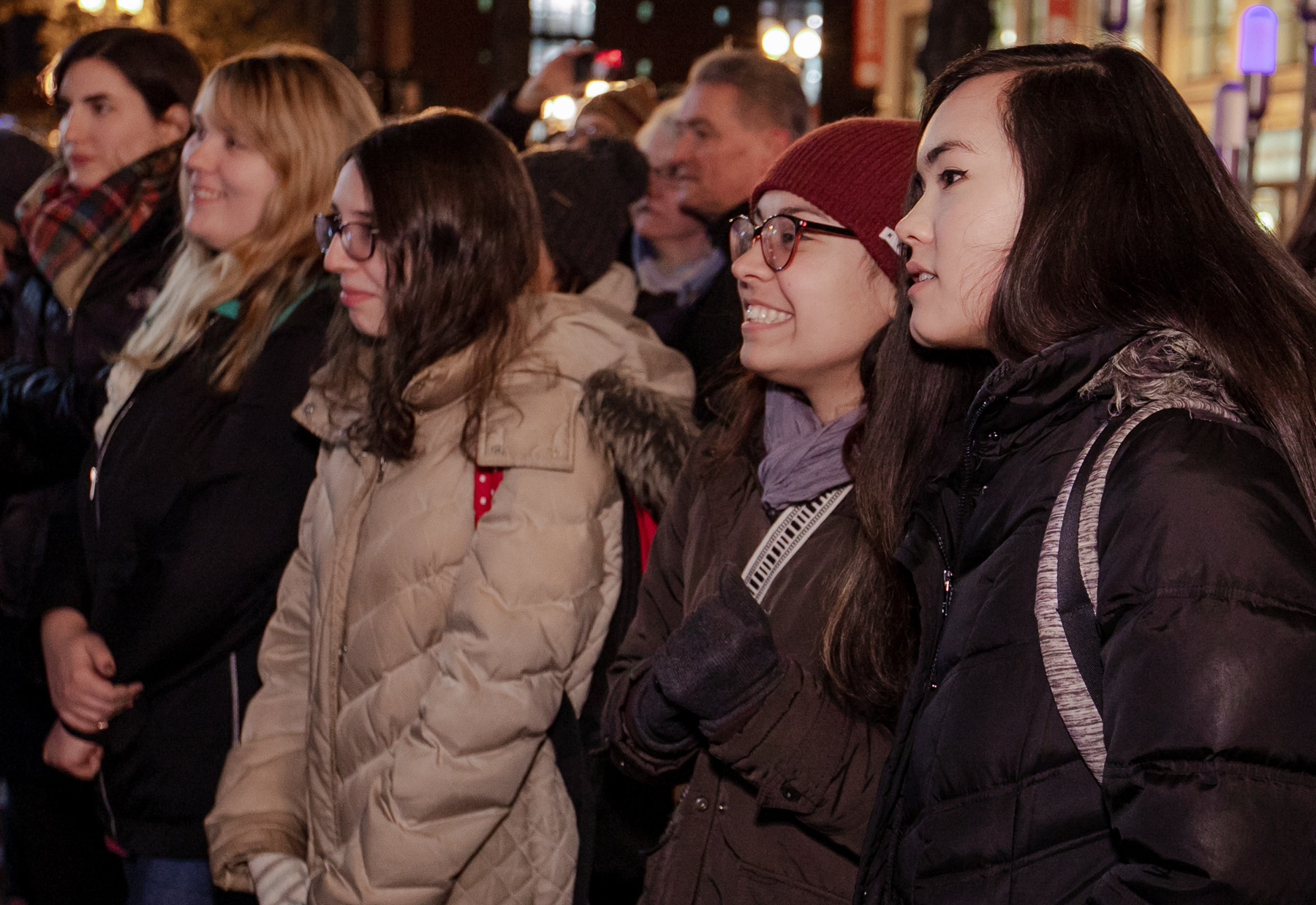 Students, faculty and staff watch the stop-motion film after its debut on State Street. The Merry Christmas from DePaul window utilizes state-of-the-art technology to build an imaginative, 3-D experience. (DePaul University/Randall Spriggs)